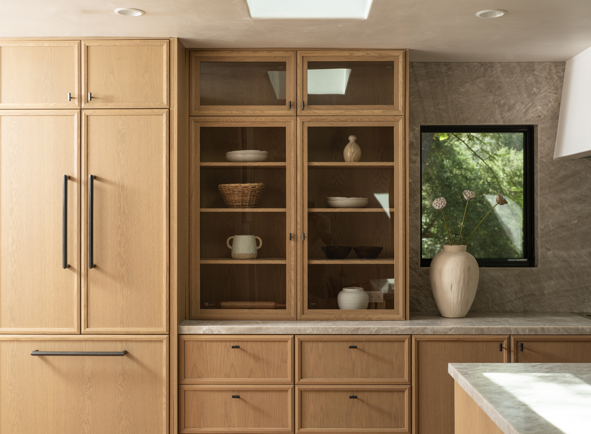 Built-in refrigeration and glass-shelved millwork