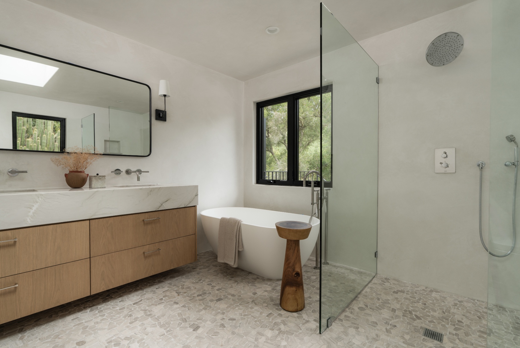 Bathroom with freestanding tub and glass shower
