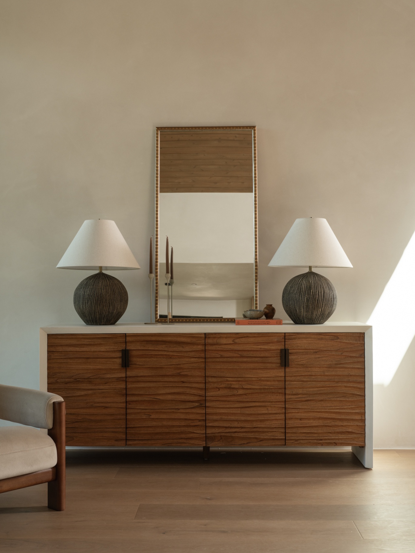 Sideboard vignette with paired lamps and mirror