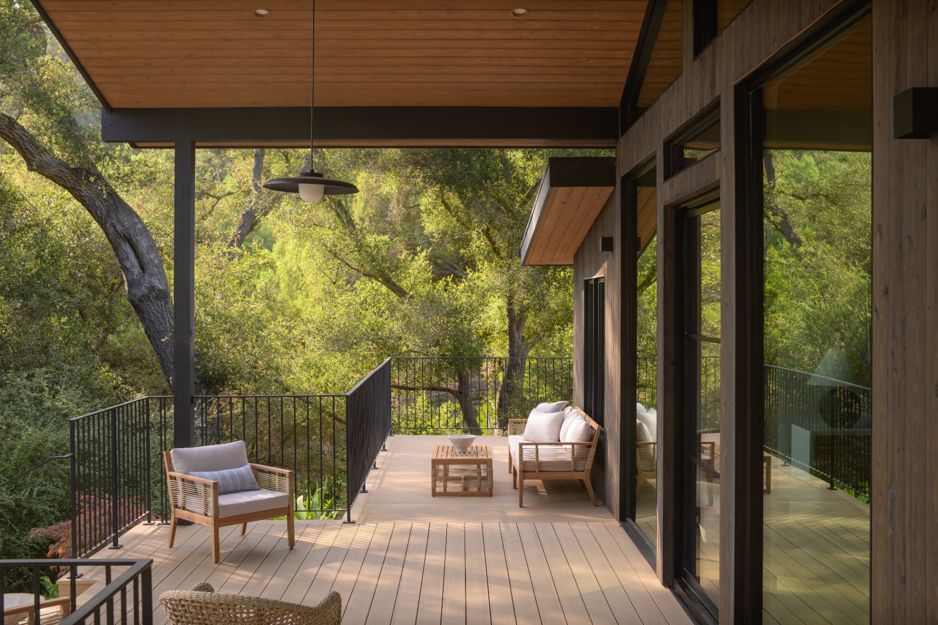 Treetop deck with lounge seating among the oaks