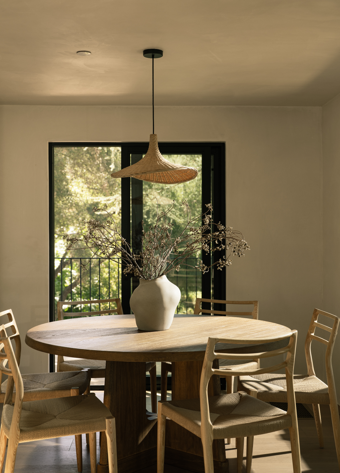 Dining room beneath the woven pendant