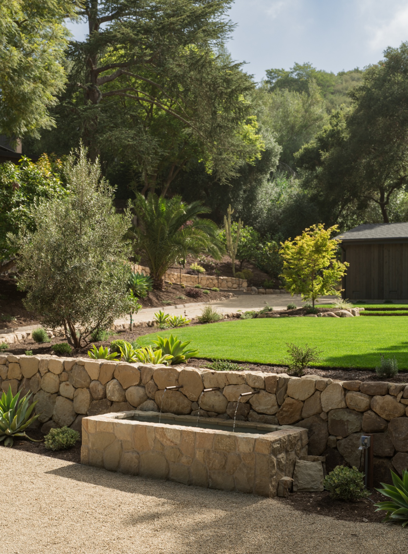 Stone retaining wall with quiet water feature