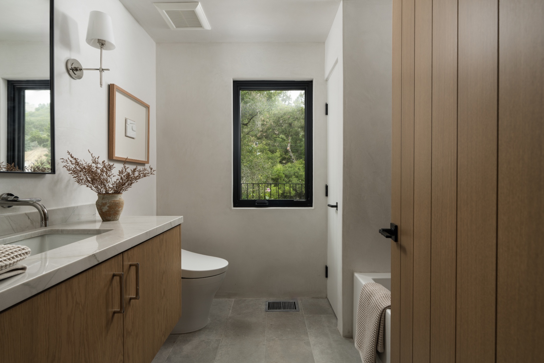Bath vanity in oak and honed stone