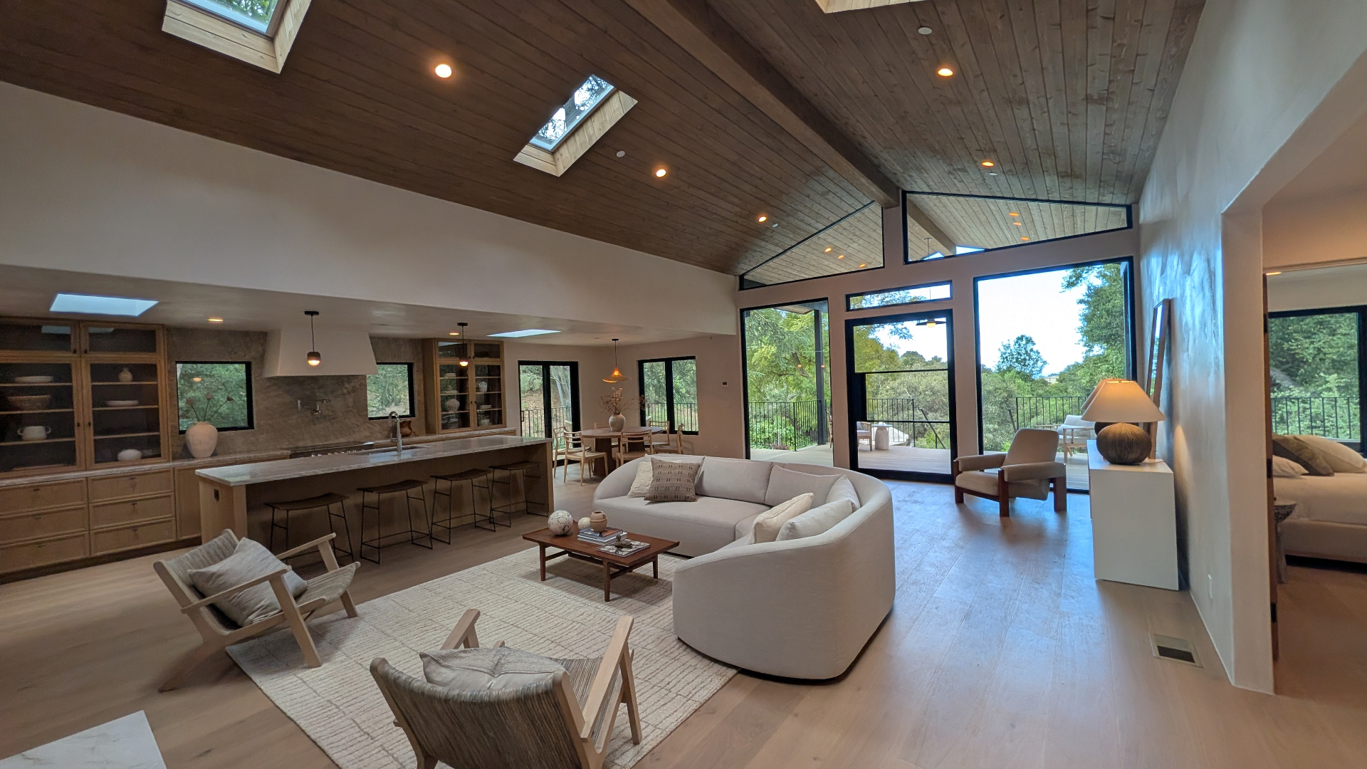 Vaulted great room opening to the deck